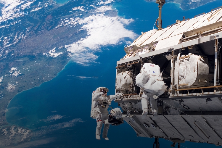 astronaut Robert L. Curbeam Jr. (left) and European Space Agency (ESA) astronaut Christer Fuglesang, both STS-116 mission specialists, participate in the mission's first of three planned sessions of extravehicular activity (EVA) as construction continues on the International Space Station.