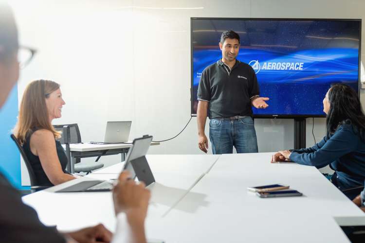Aerospace employees in a meeting.