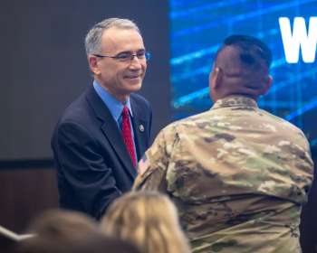 Steve Isakowitz greets Tech Expo attendees